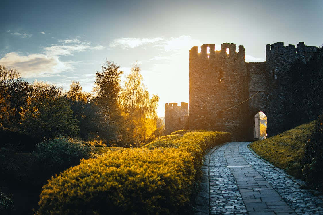 A Peaceful Landscape Of A Village In The Middle Ages Wallpaper