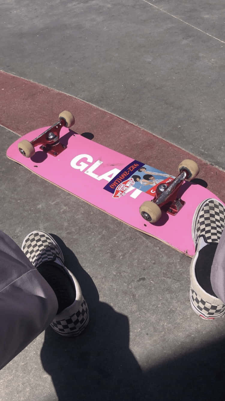 A Person Is Sitting On A Skateboard Wallpaper