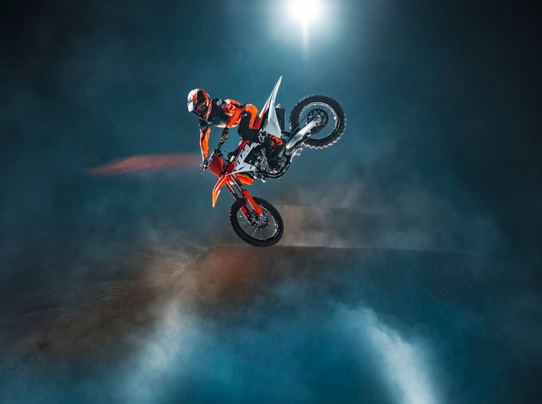 A Person Riding A Dirt Bike In The Dark Wallpaper