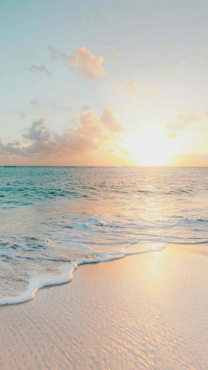 A Picturesque View Of The Ocean Sunset. Wallpaper