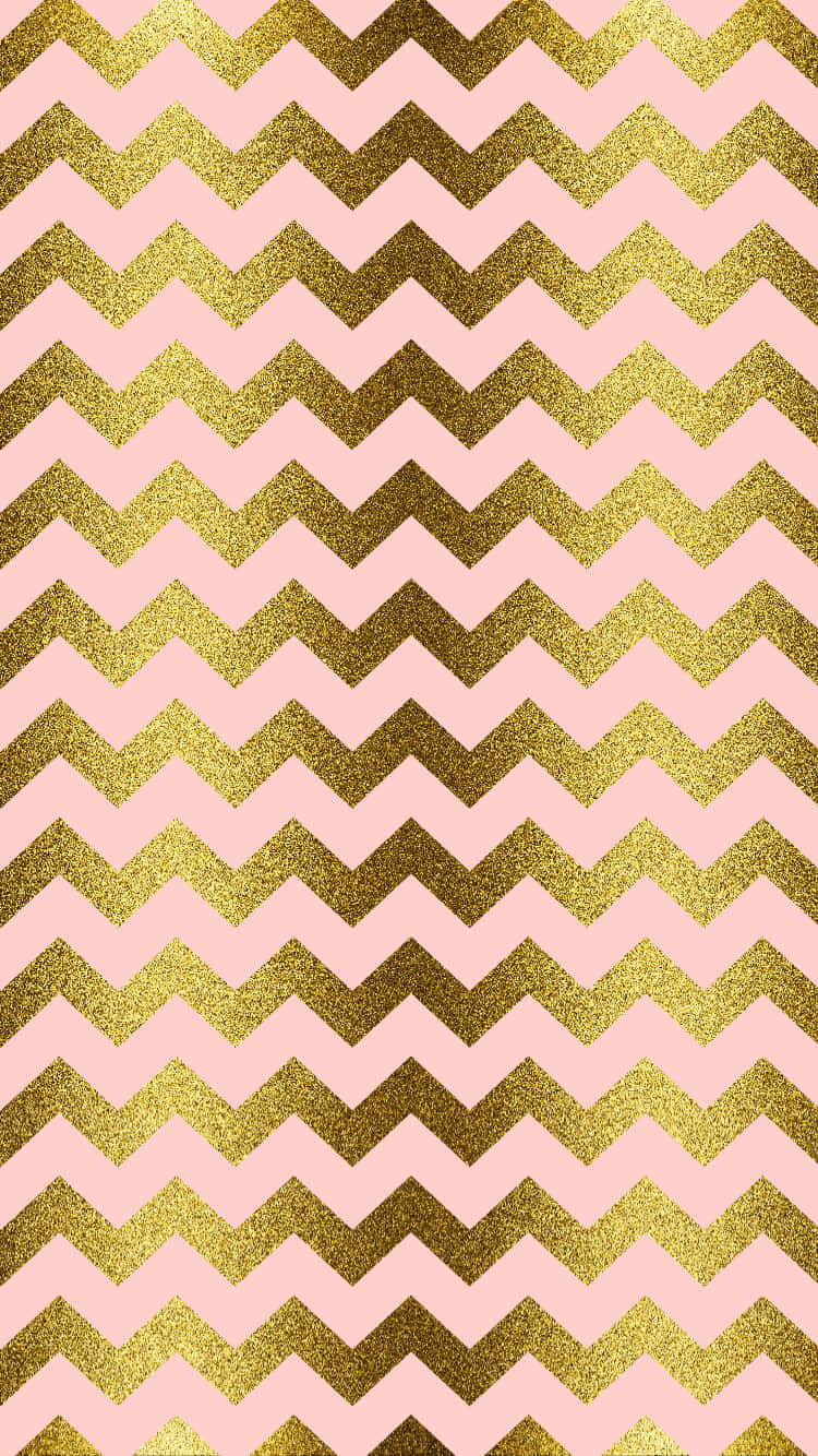 A Pink And Gold Chevron Pattern Wallpaper