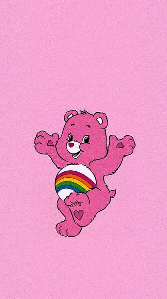 A Pink Bear With A Rainbow Ball In His Arms Wallpaper