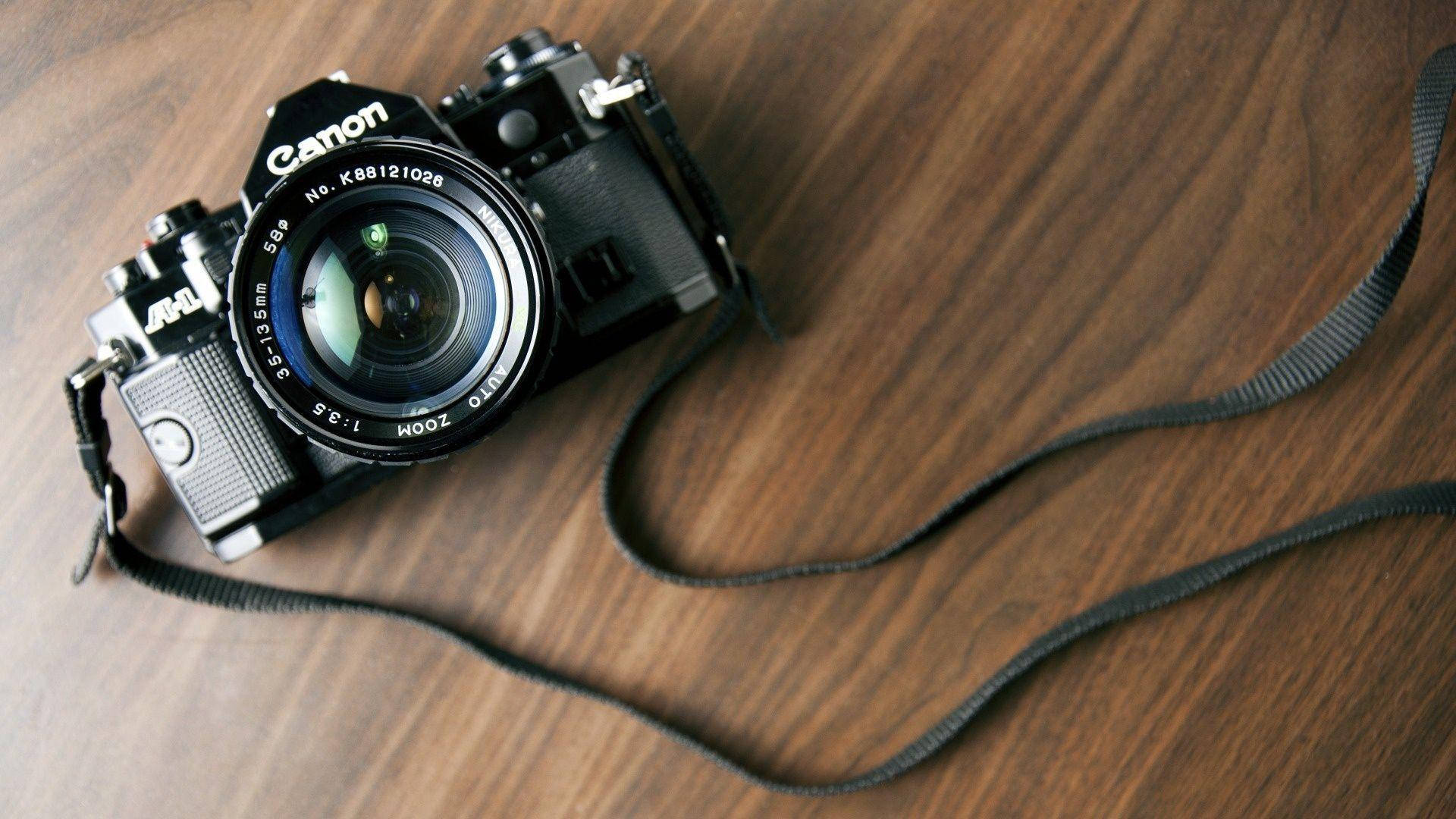 A Professional Canon Hd Camera In Black Wallpaper