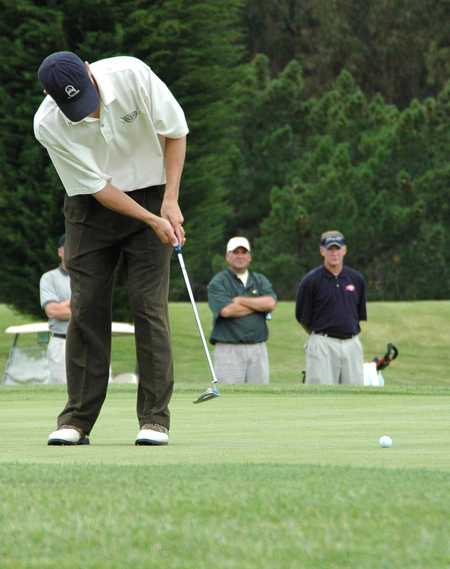 A Professional Golfer In Action During A Game Wallpaper