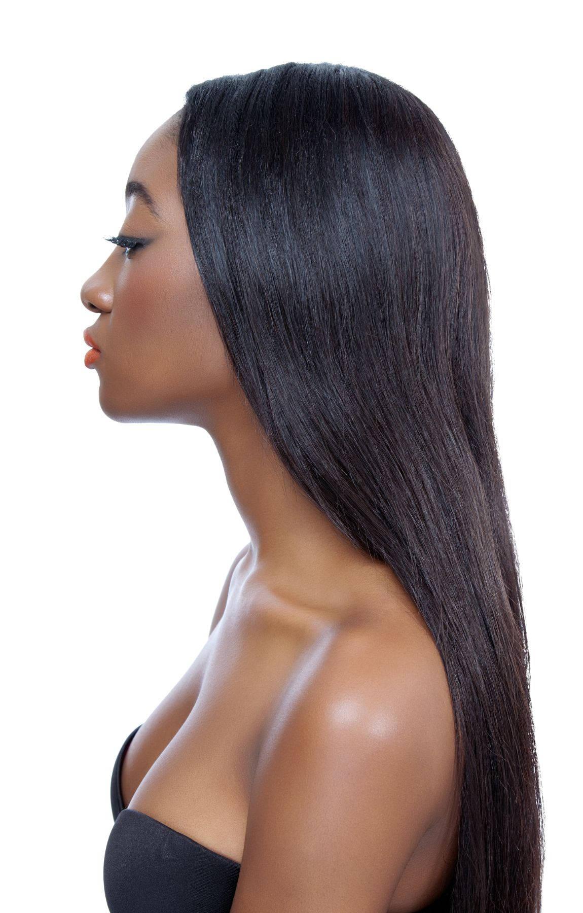 A Radiant African Woman Showcasing Her Long, Silky Hair. Wallpaper