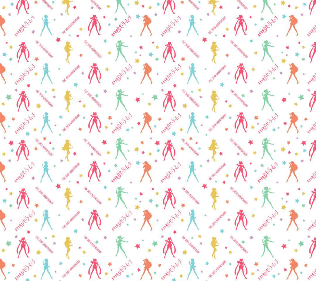 A Rainbow-embroidered Sailor Moon Pattern On A Pink Background Wallpaper