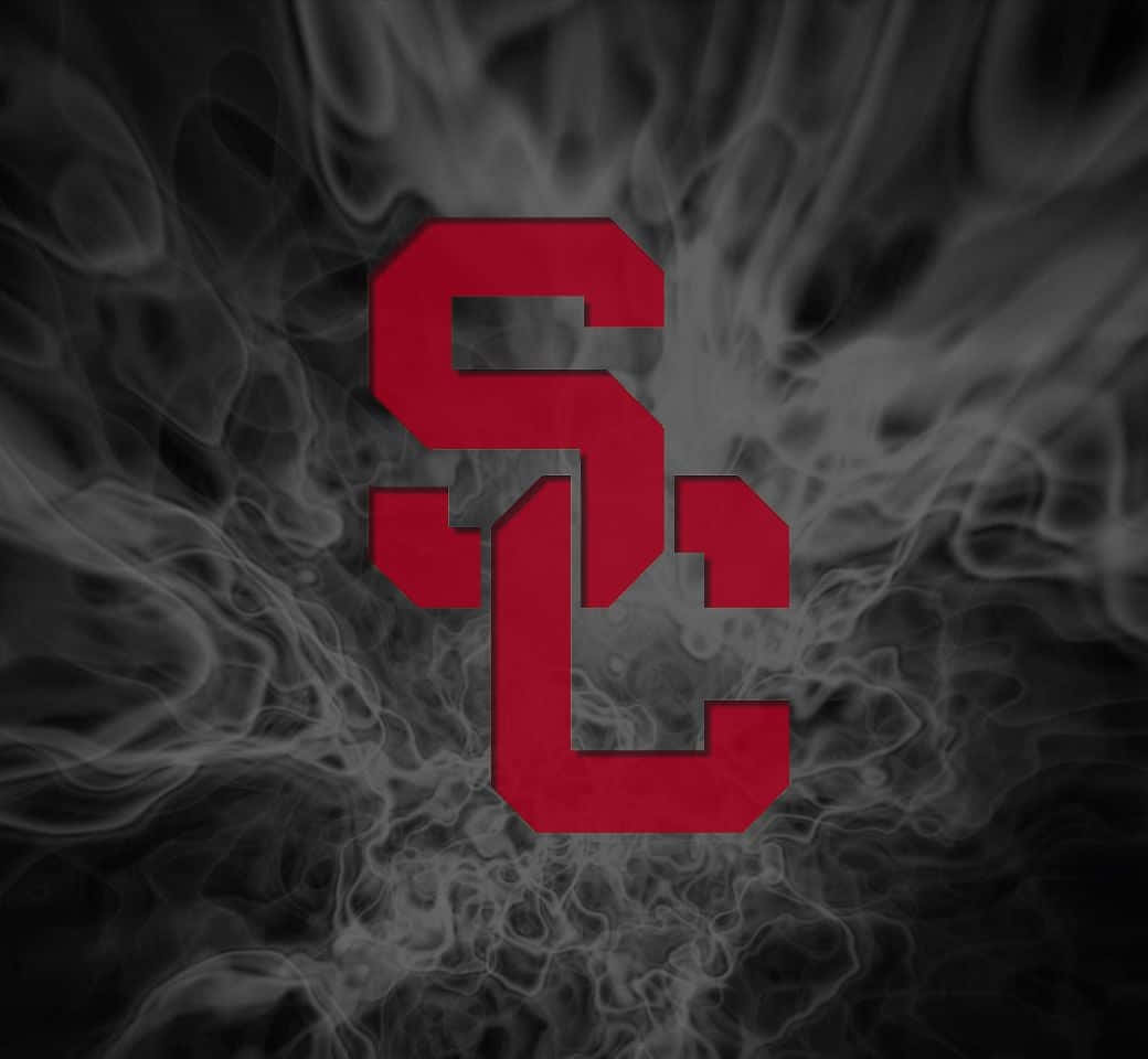 A Red And Black Logo With Smoke In The Background Wallpaper
