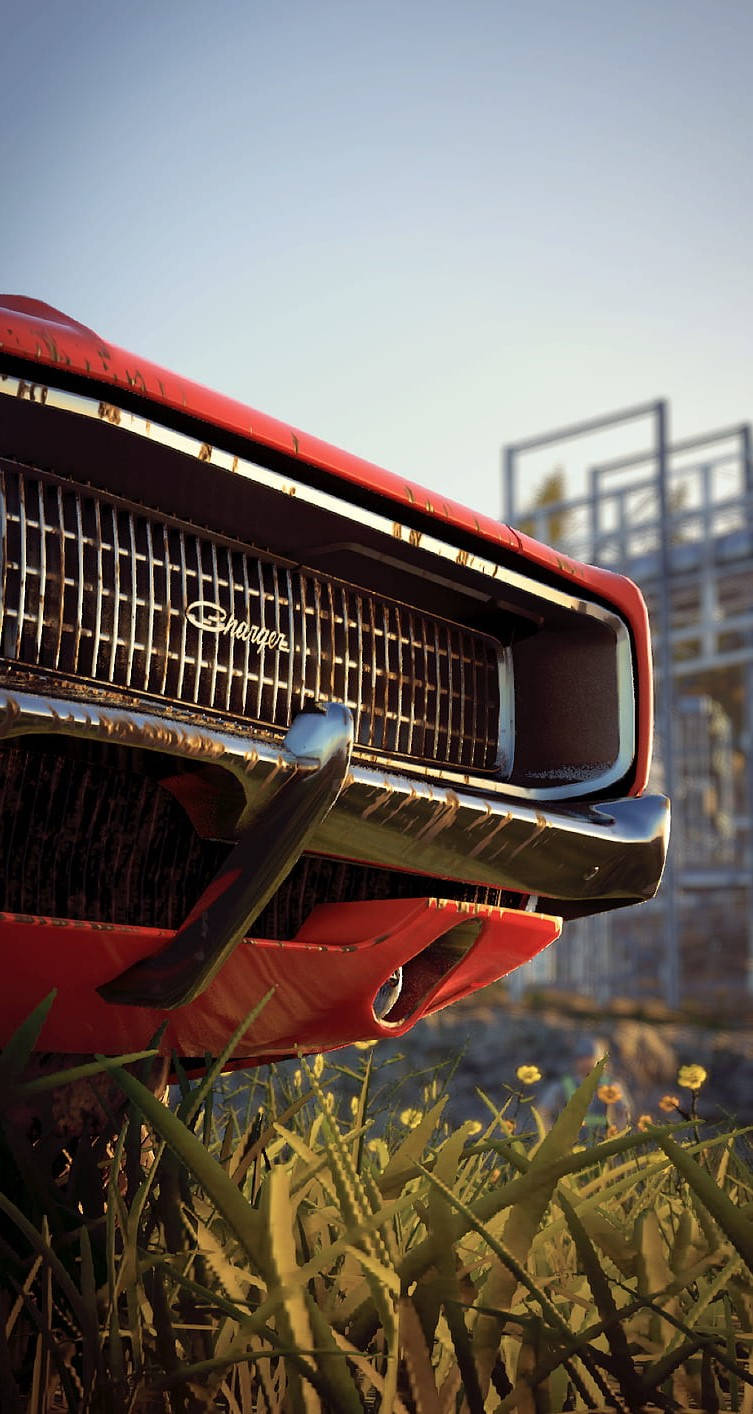 A Red Car With A Grill In The Grass Wallpaper