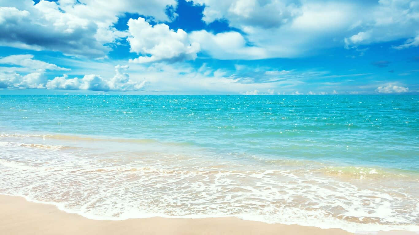 A Serene Summer Day Spent Relaxing At The Beach. Wallpaper