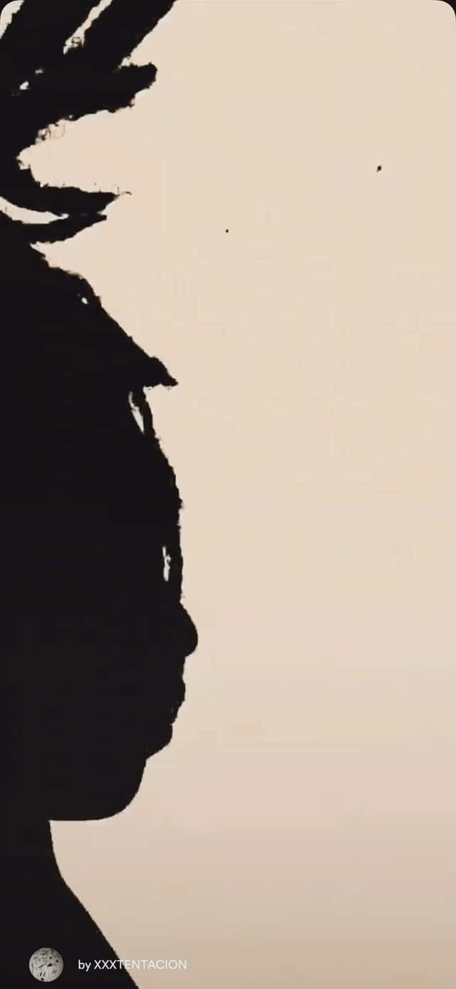 A Silhouette Of A Person With Dreadlocks Wallpaper