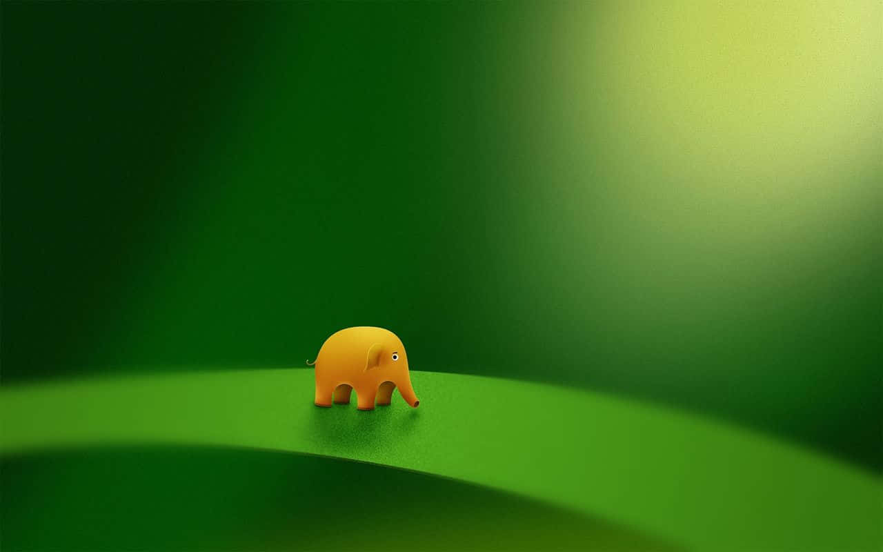 A Small Yellow Elephant Standing On A Green Leaf Wallpaper