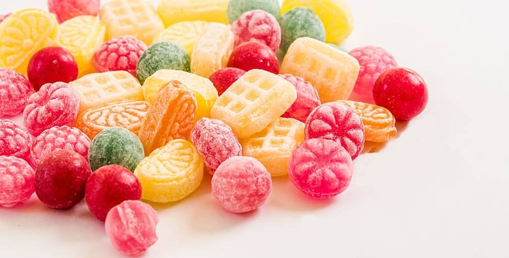 A Study In Sweetness - Opaque Sugar Candies With Frosting Wallpaper