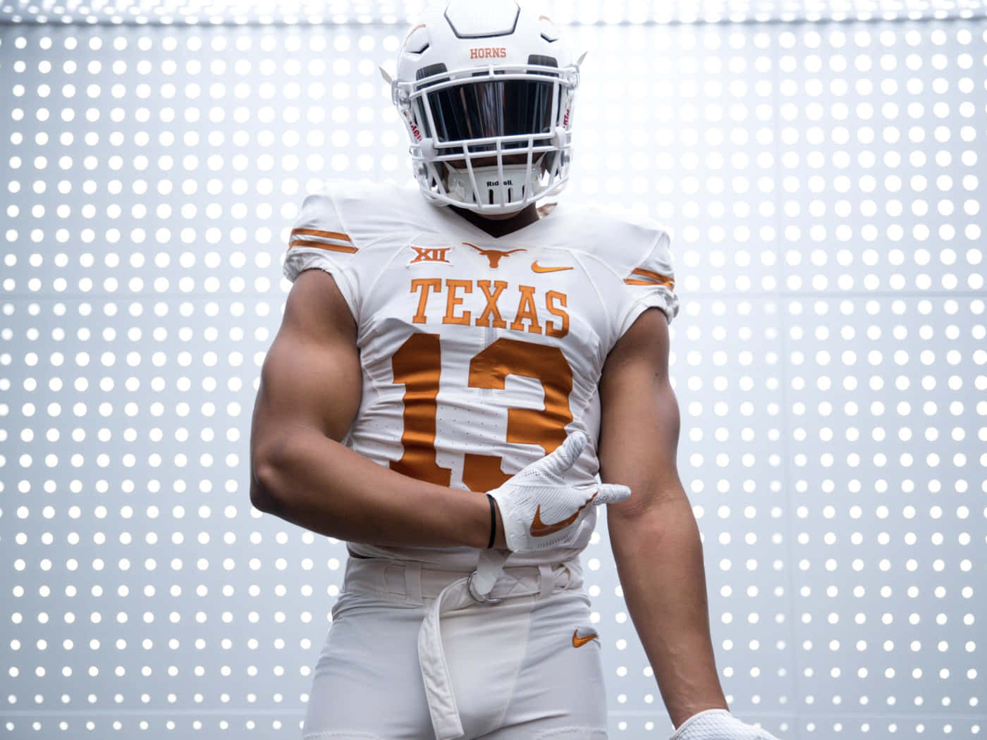 A Texas Football Player In A Uniform Wallpaper