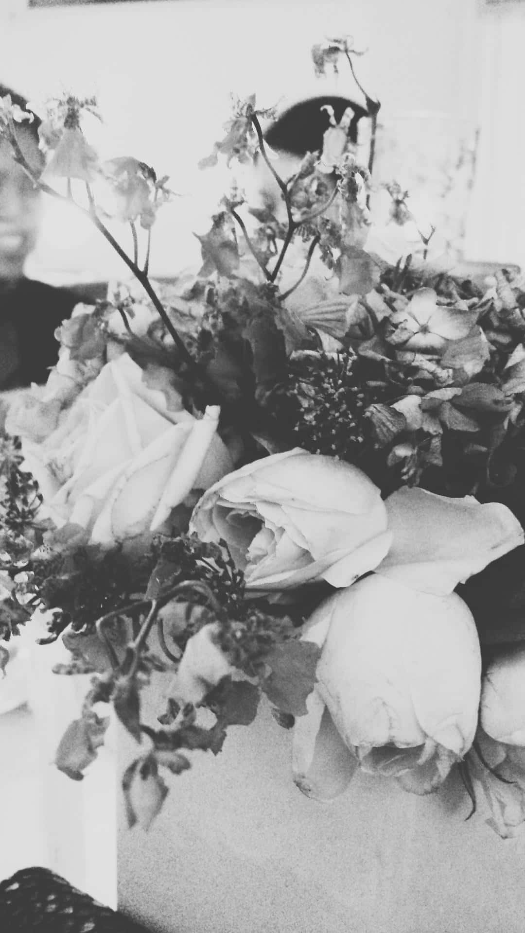 A Vase Of Flowers On A Table Wallpaper