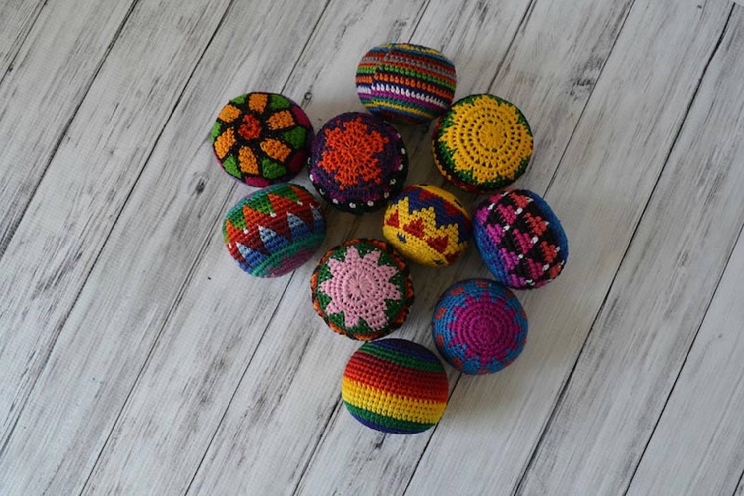 A Vibrant Crochet Hacky Sack In Dark Colors Wallpaper