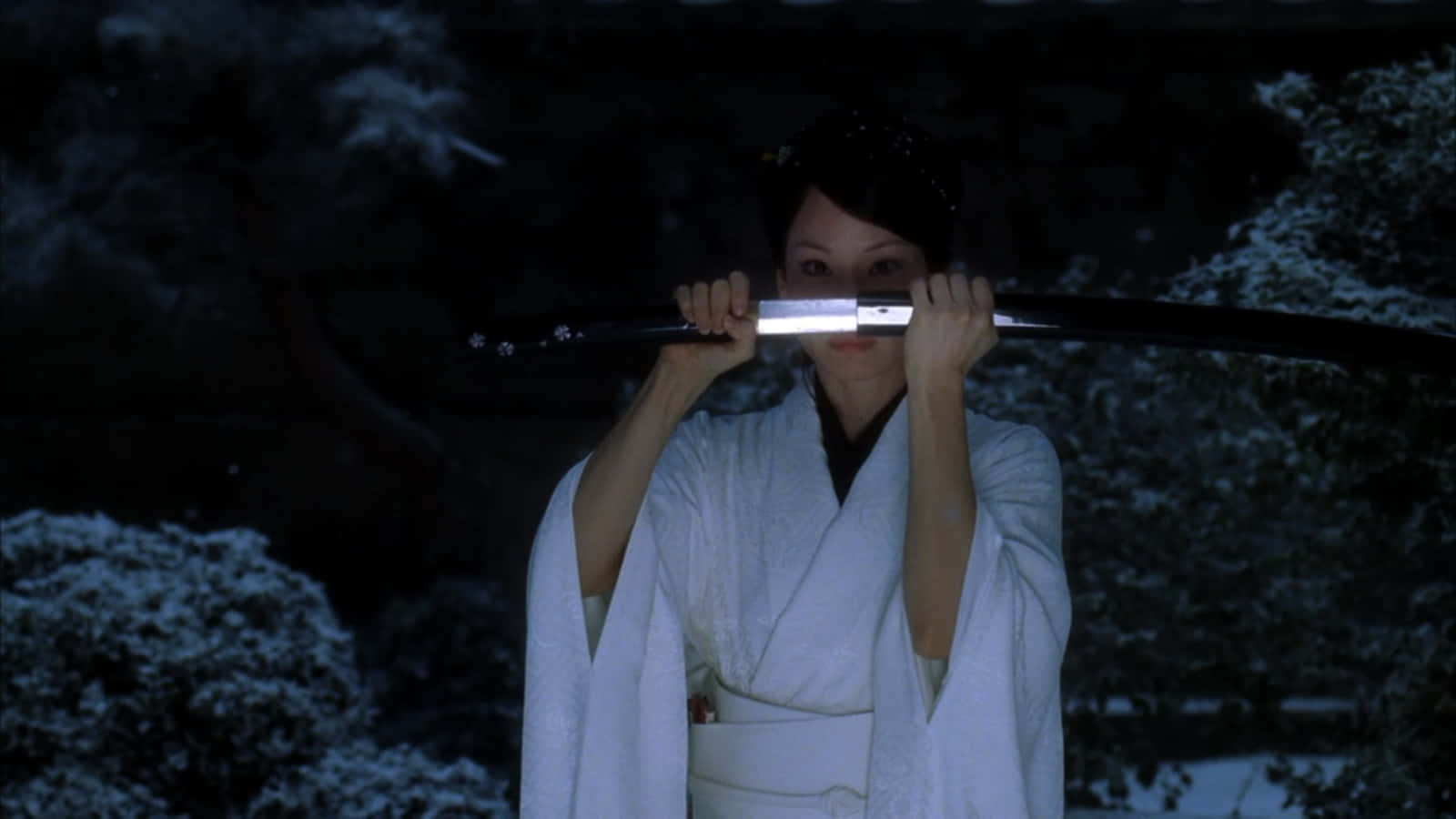 A Woman In A White Robe Holding A Sword Wallpaper