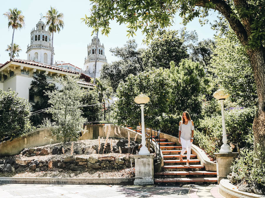 A Woman Walking Down The Stairs Of Hearst Castle Wallpaper