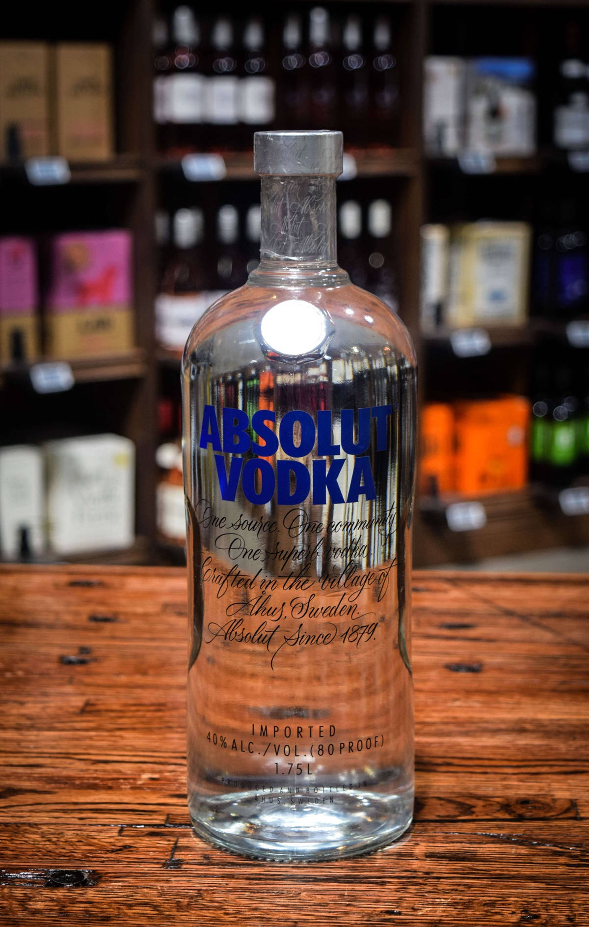 Absolut Vodka Bottle On Wood Table Selective Focus Wallpaper