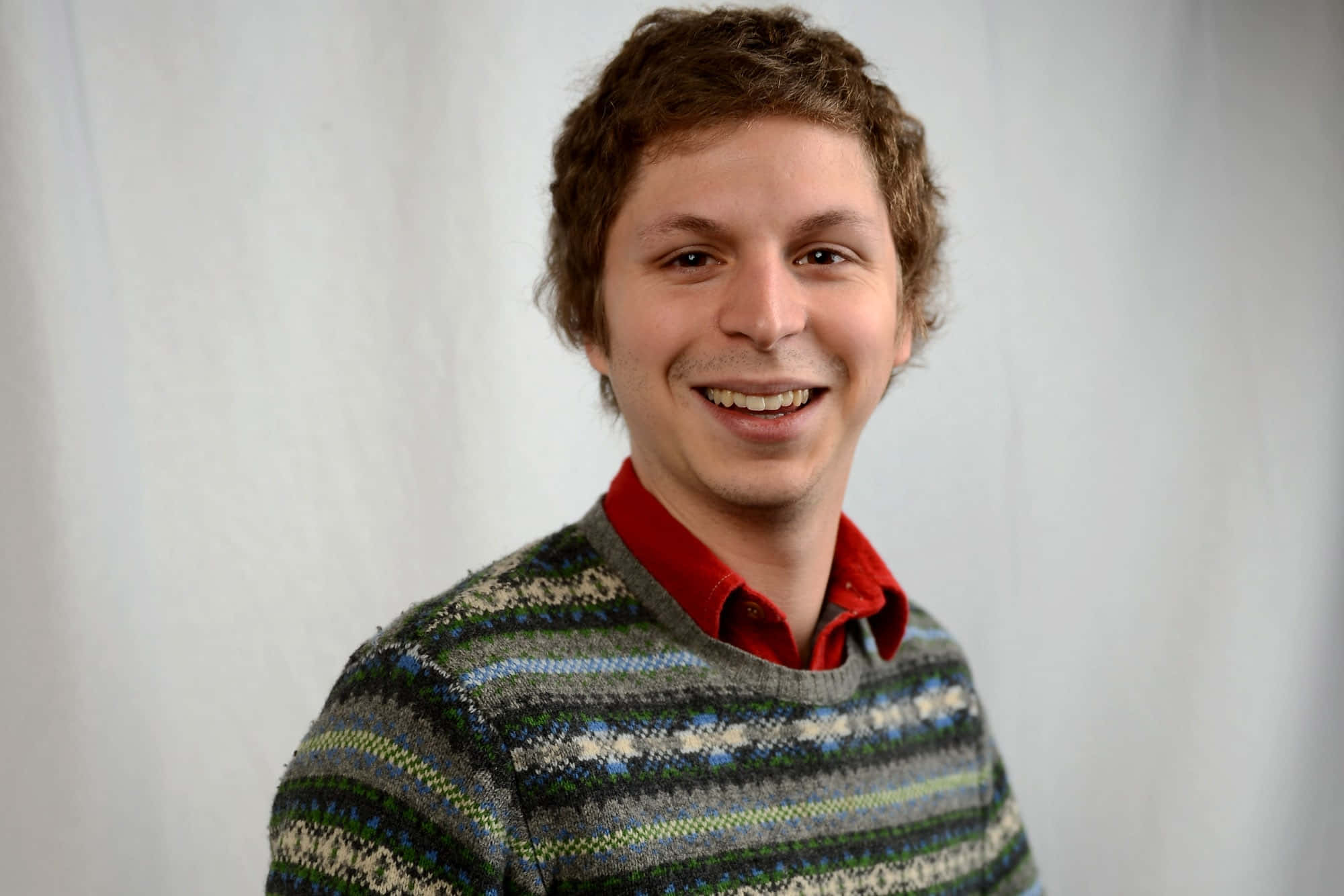 Actor Michael Cera Poses With A Guitar Wallpaper
