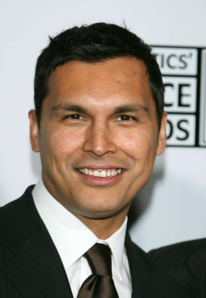 Adam Beach Smilingin Suitat Event Wallpaper