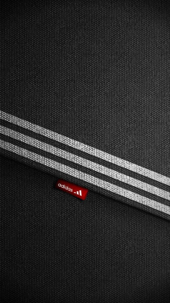 Adidas Iphone Logo On Fabric Material Wallpaper
