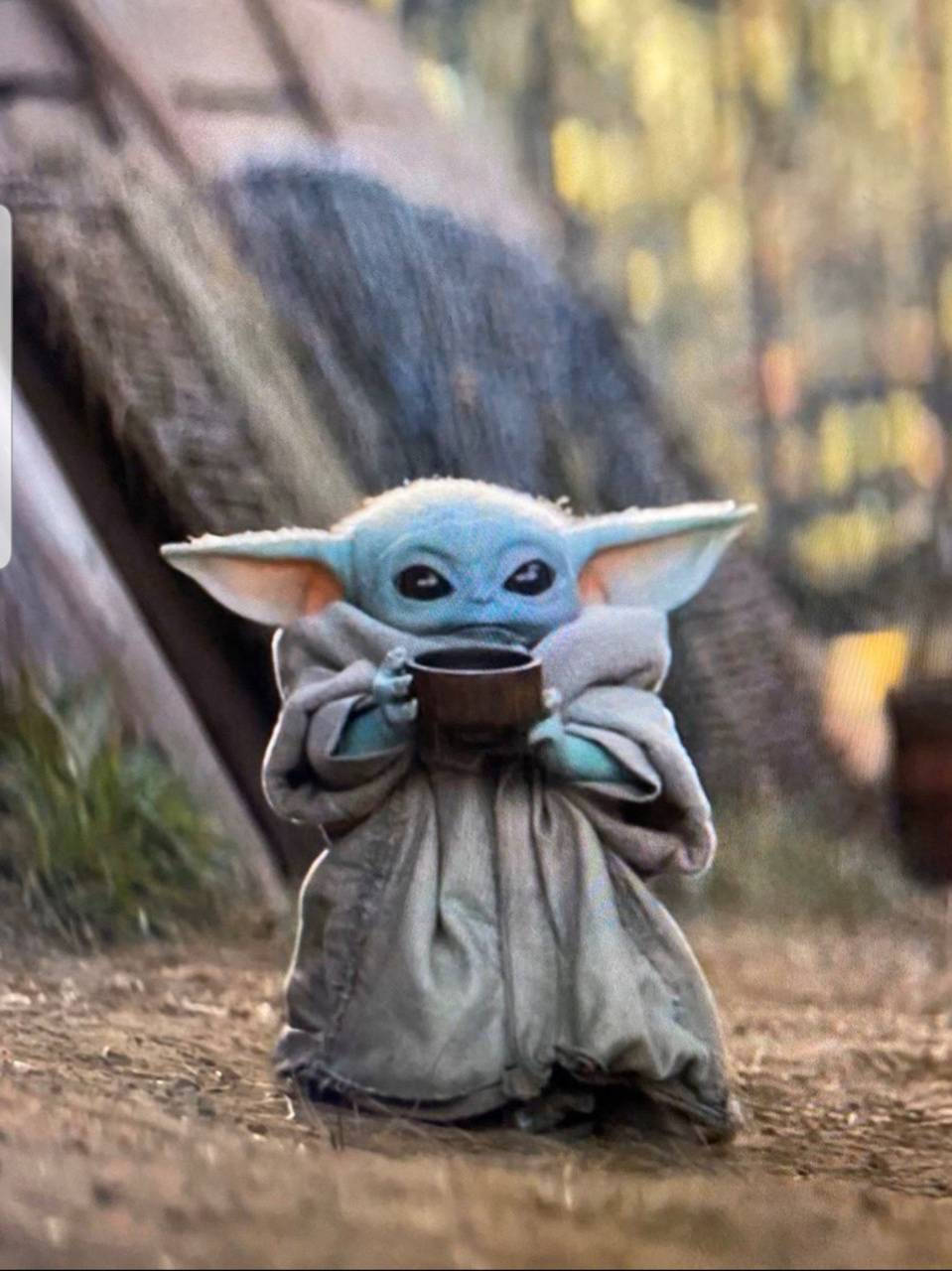 Adorable Baby Yoda With Tea Wallpaper