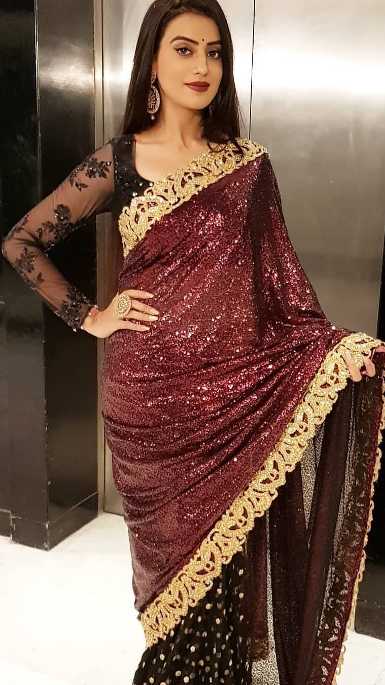 Akshara Singh Glowing In A Sparkly Dress Wallpaper