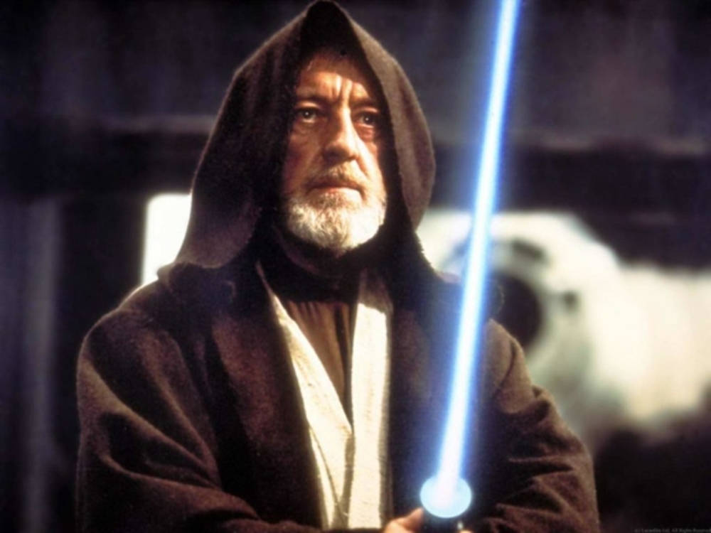 Alec Guinness With Light Saber Wallpaper