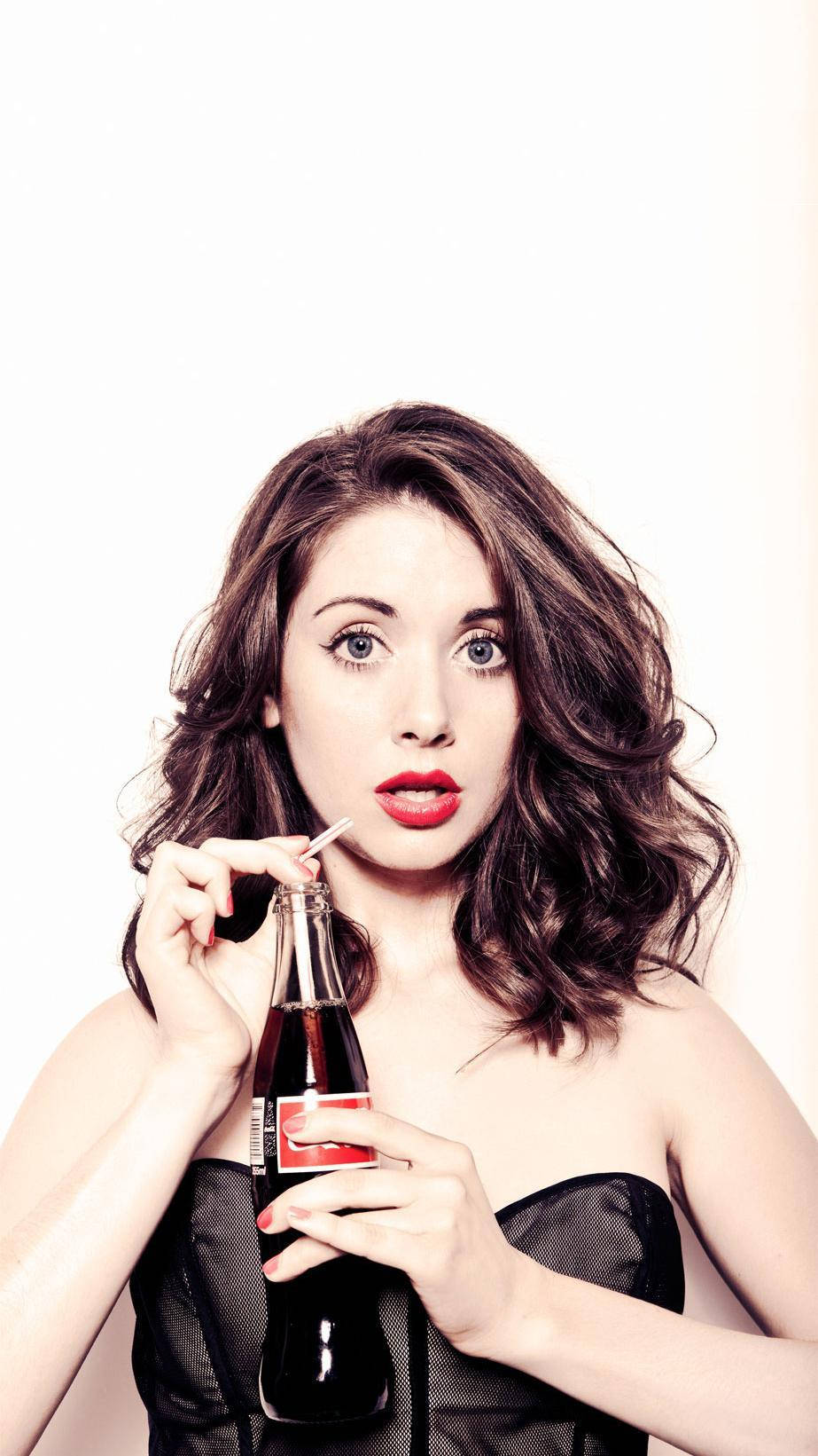 Alison Brie And Her Coke Bottle Wallpaper