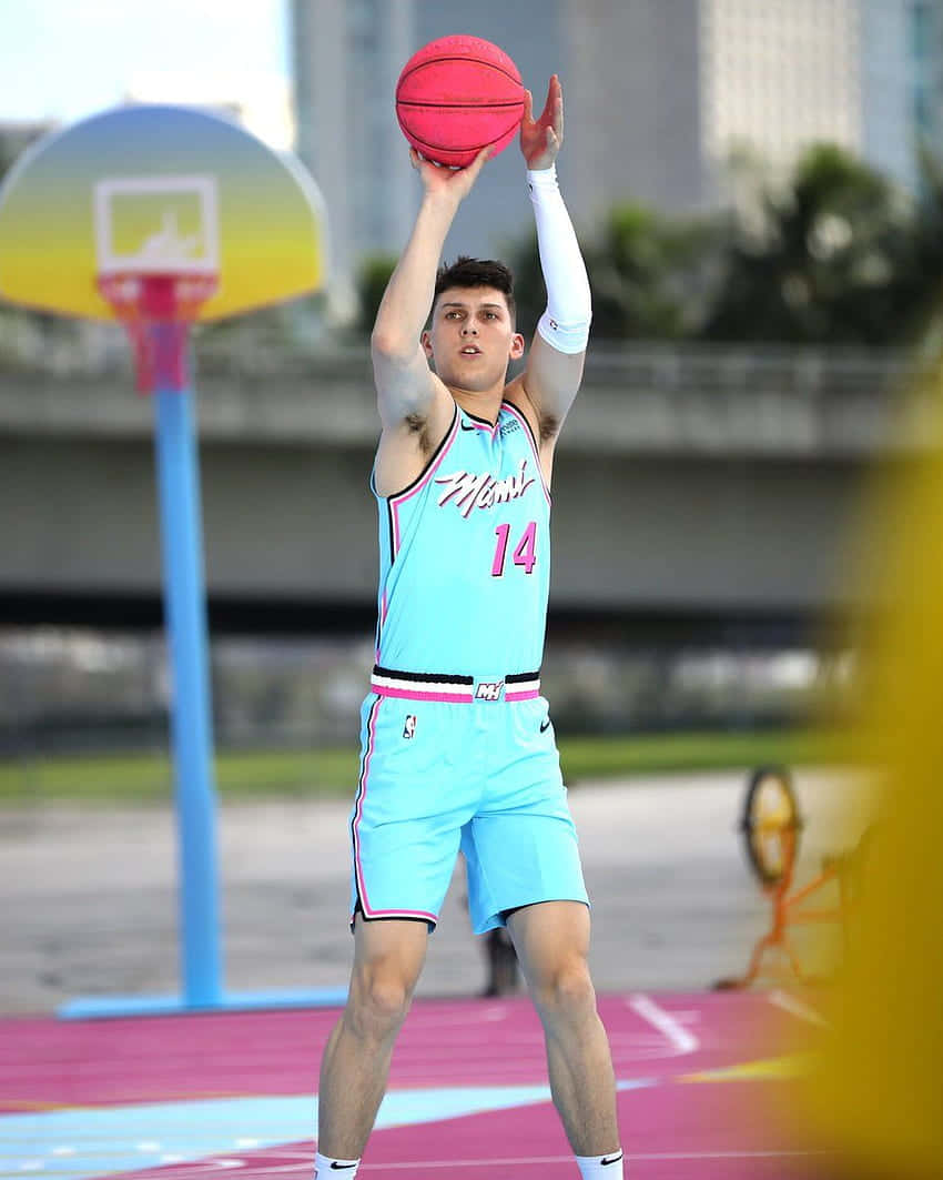 All-star Rookie Tyler Herro Shooting A Three-pointer Wallpaper