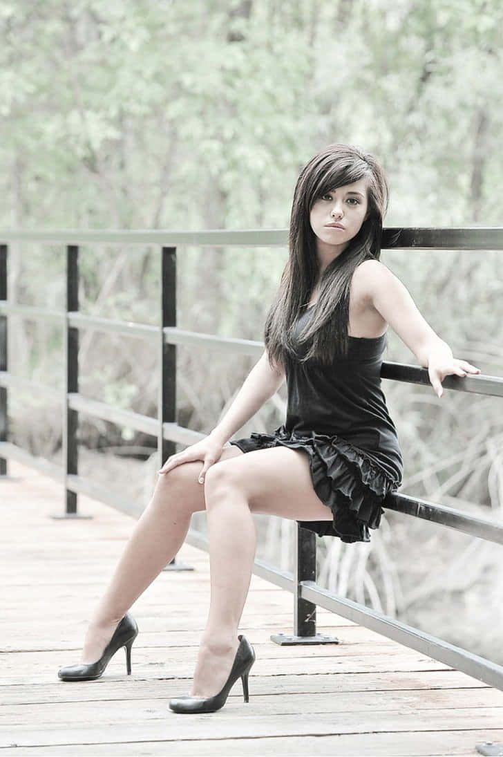 Amateur Model On Bridge Railing Wallpaper