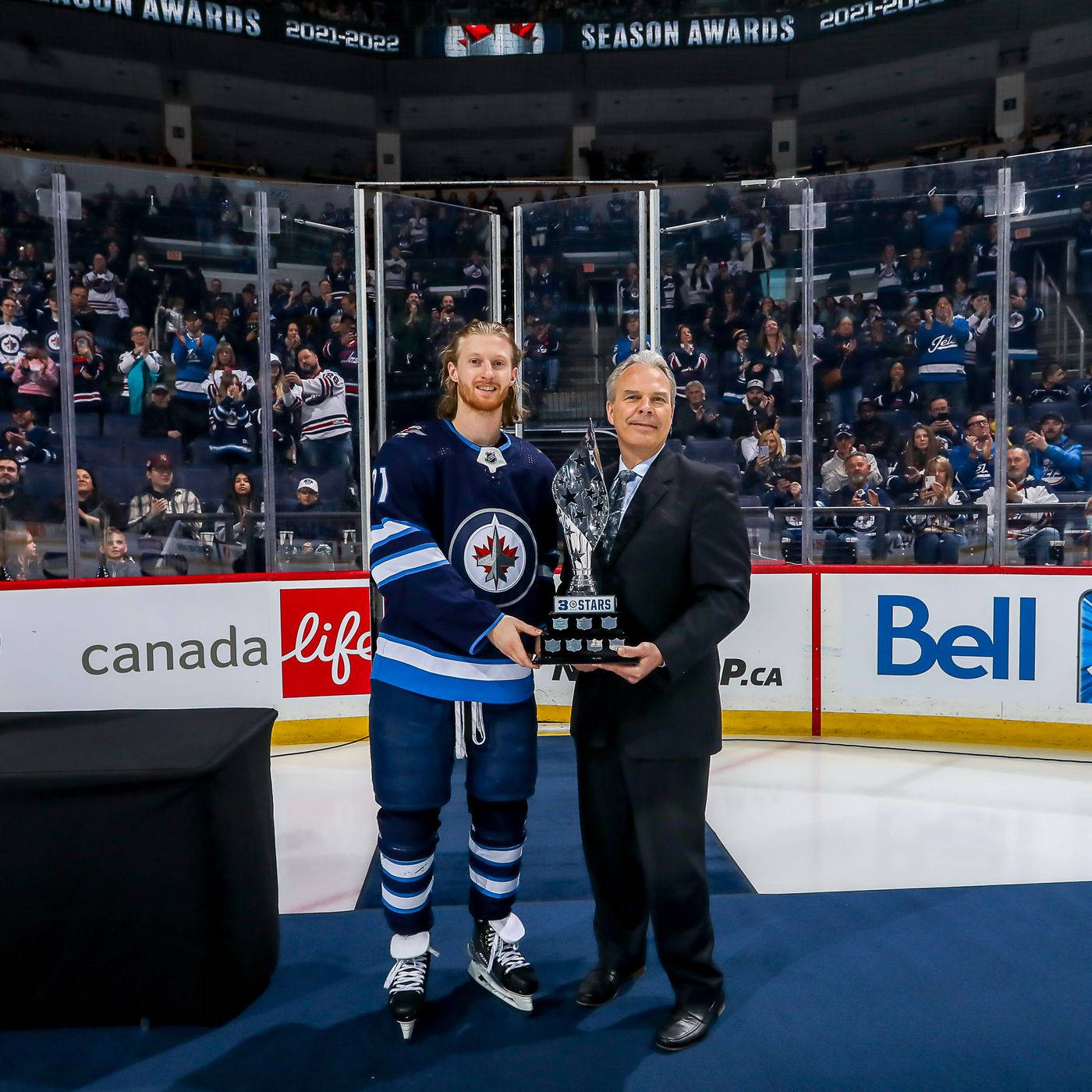 American Ice Hockey Player Kyle Connor With Three Stars Award Wallpaper