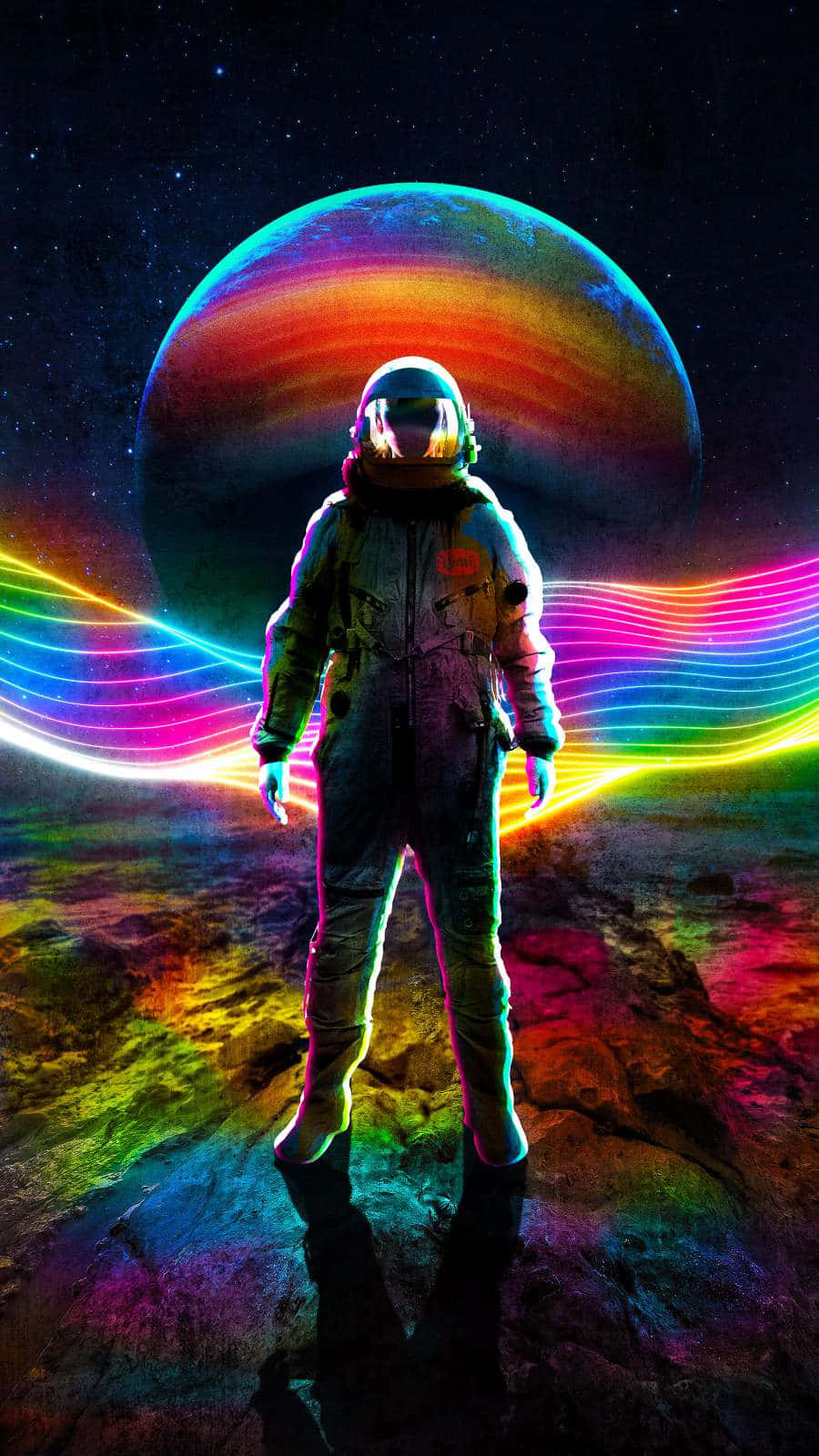 An Astronaut Standing In Front Of A Rainbow Colored Planet Wallpaper