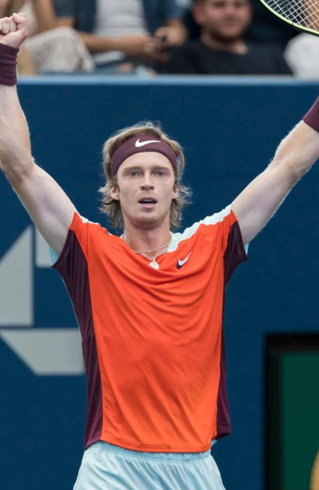 Andrey Rublev In Orange Tennis Shirt Wallpaper