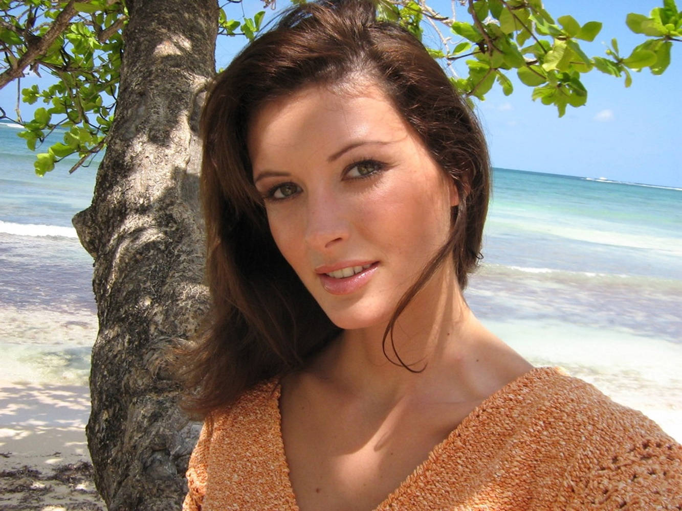 April Bowlby Near A Tree At The Beach Wallpaper