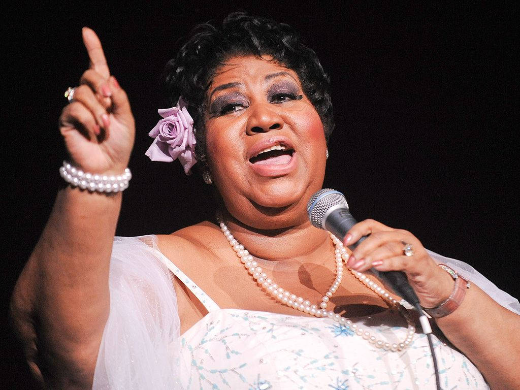 Aretha Franklin, Elegant And Soulful, Bearing A Single Rose Wallpaper