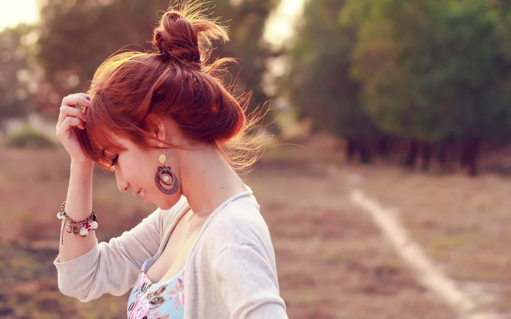 Asian Woman Profile With Messy Bun Wallpaper