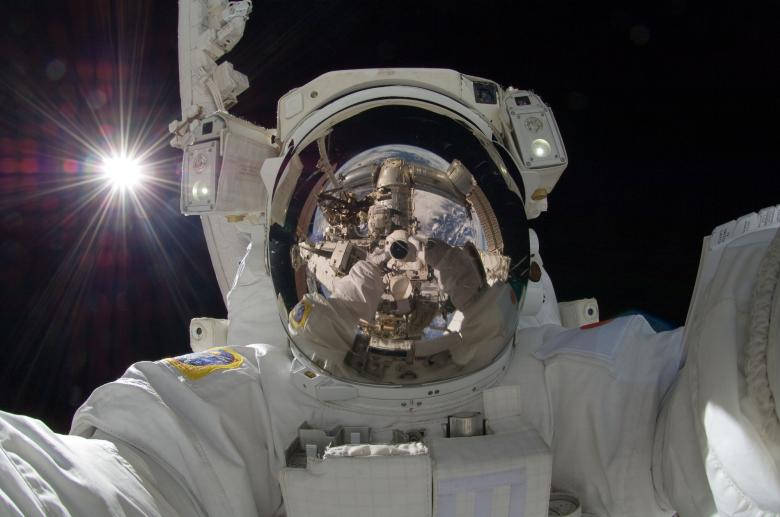 Astronaut In Space Taking A Selfie Wallpaper