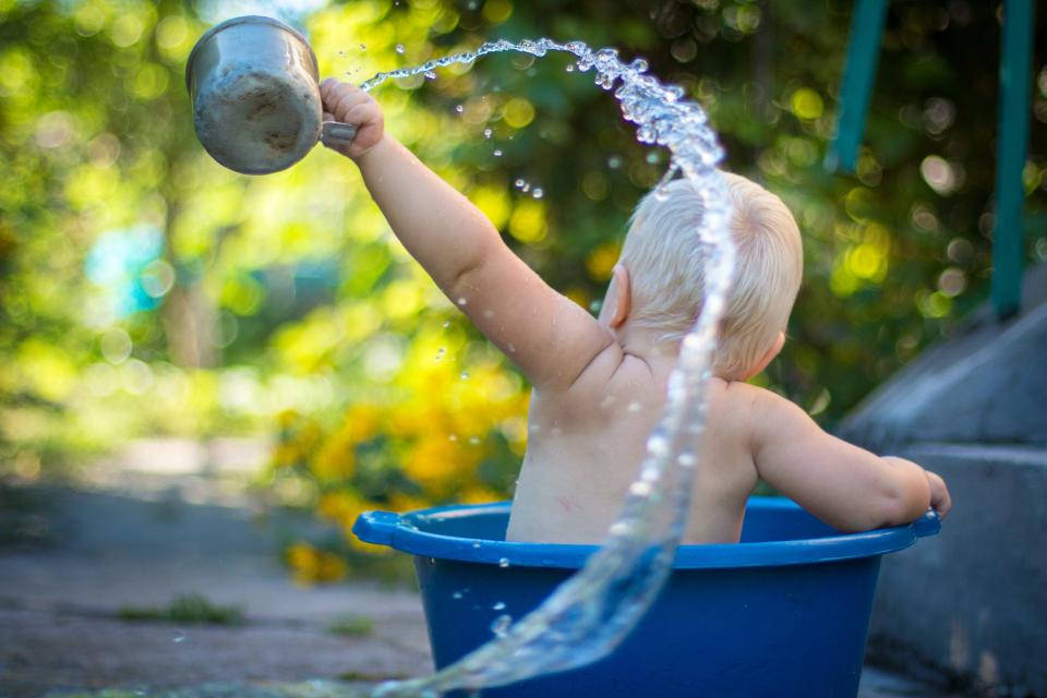 Baby Boy Splashing Water Wallpaper