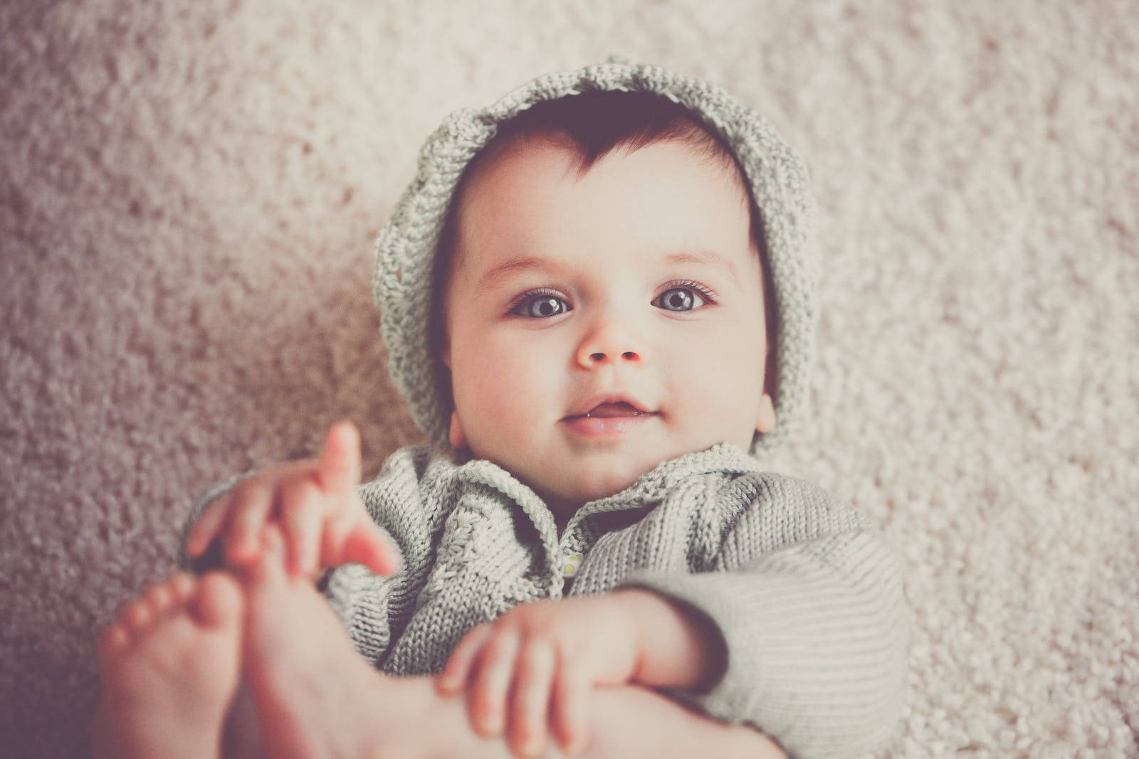 Baby Boy Wearing Gray Knitted Outfit Wallpaper