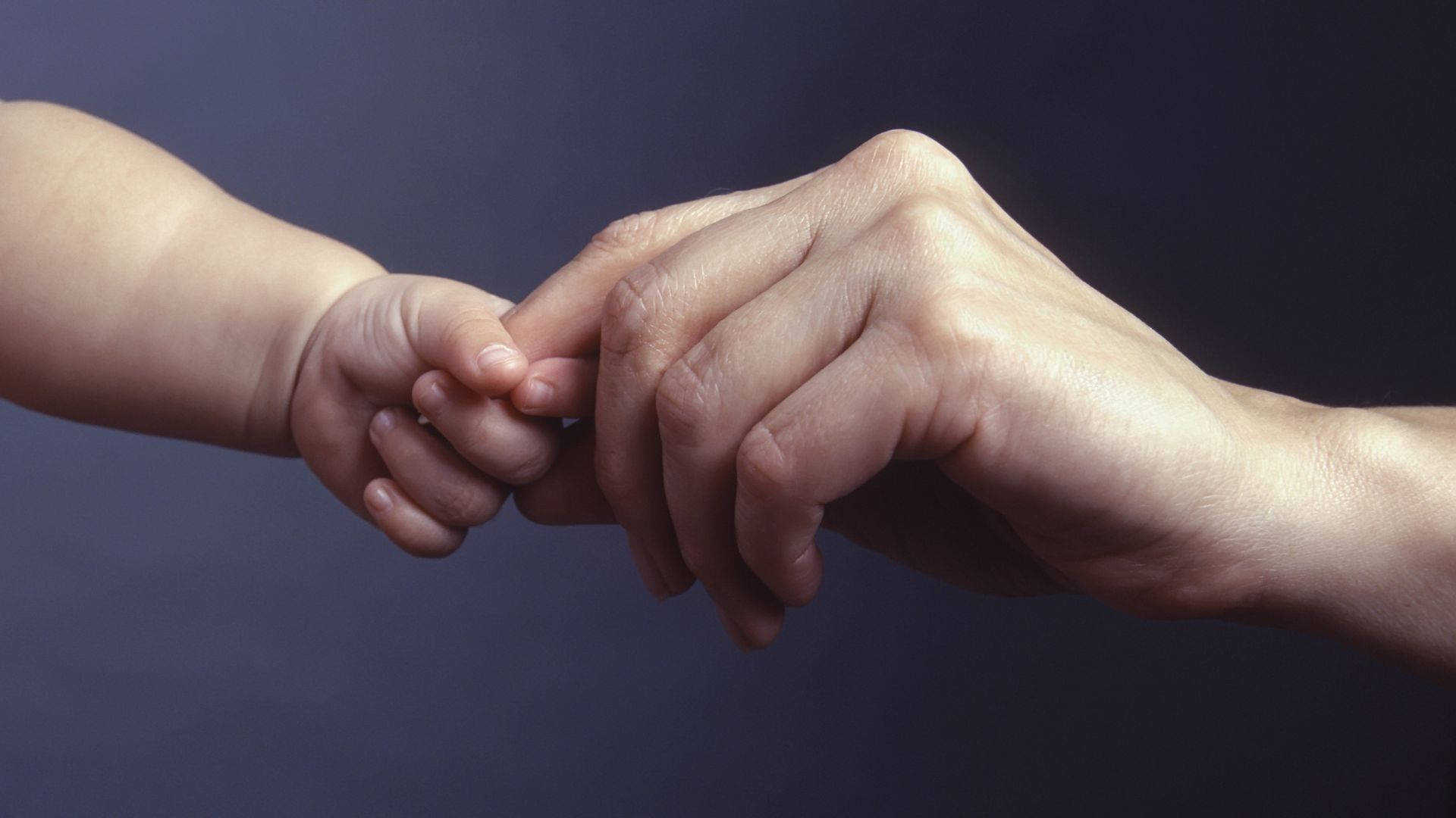 Baby Hand Shaking Mother's Finger Wallpaper