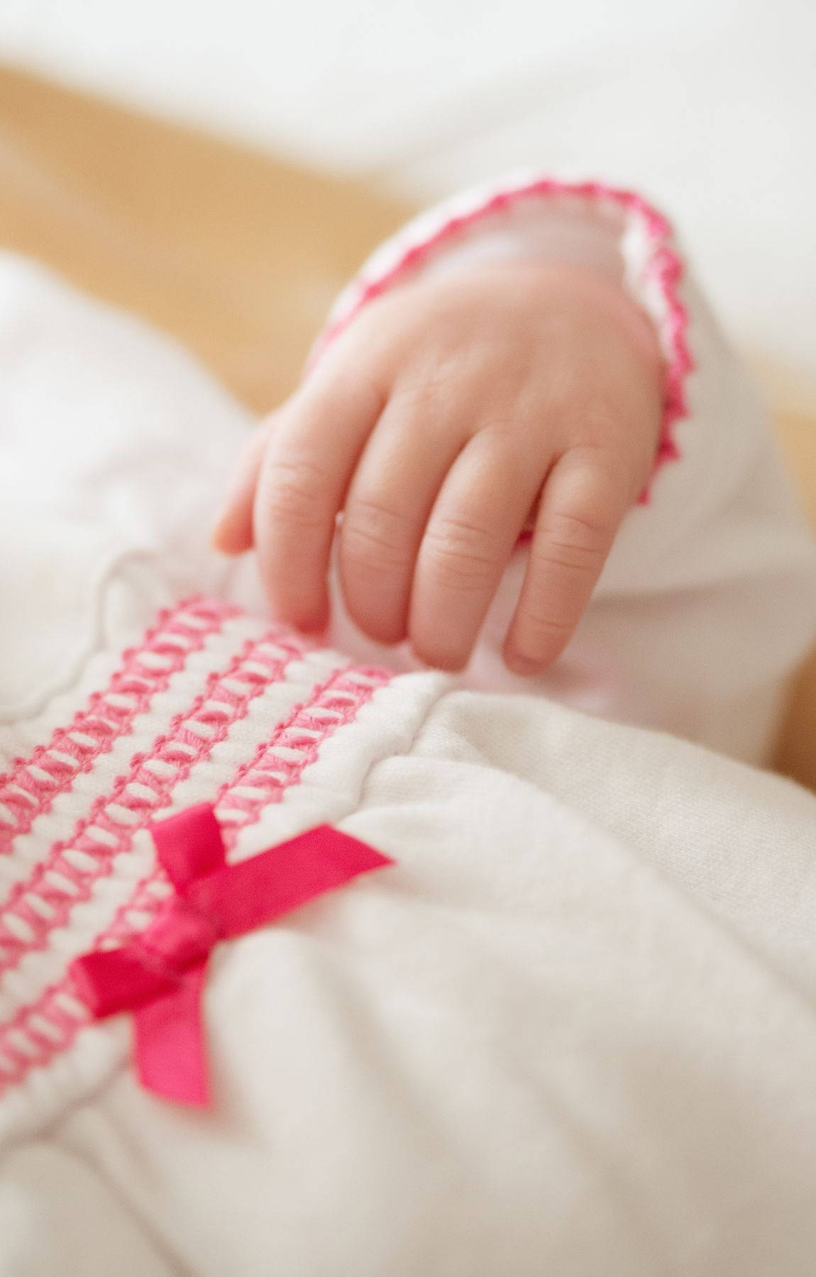 Baby Hand White And Pink Dress Wallpaper