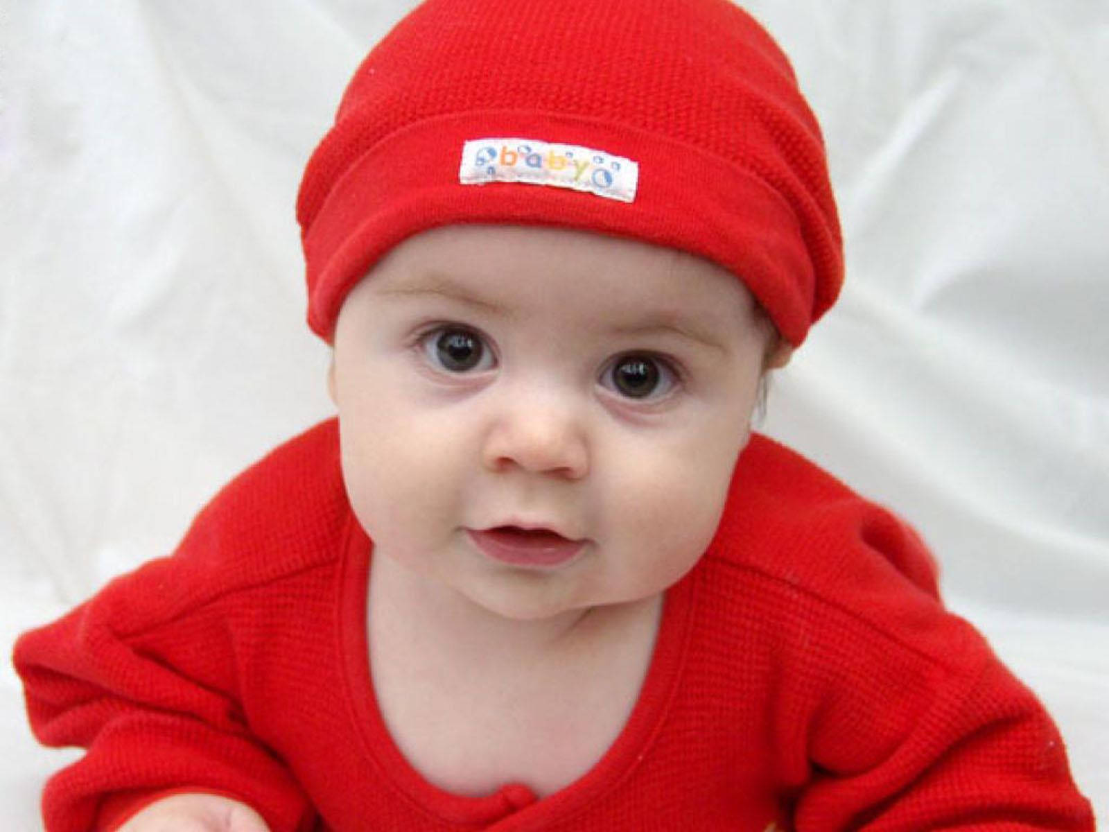Baby In Red Outfit Is Ready For Playtime Wallpaper