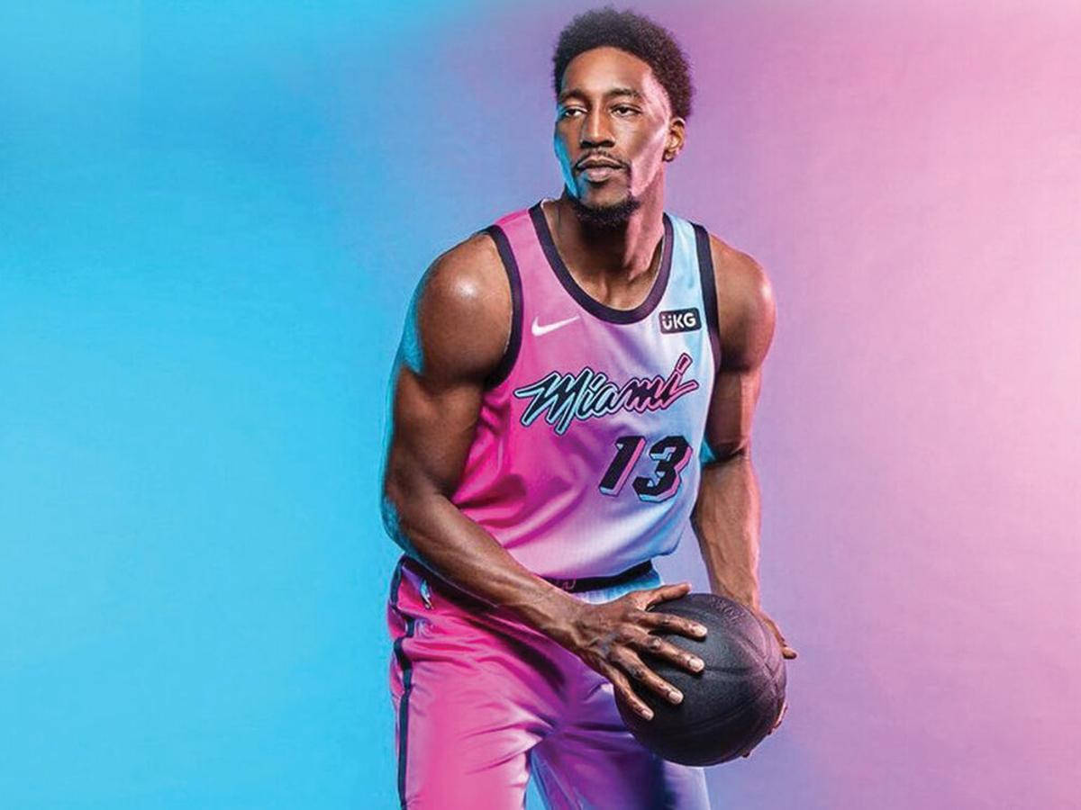 Bam Adebayo Against Blue And Pink Wallpaper