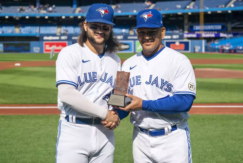 Baseballer Kevin Gausman Receiving A Trophy Wallpaper