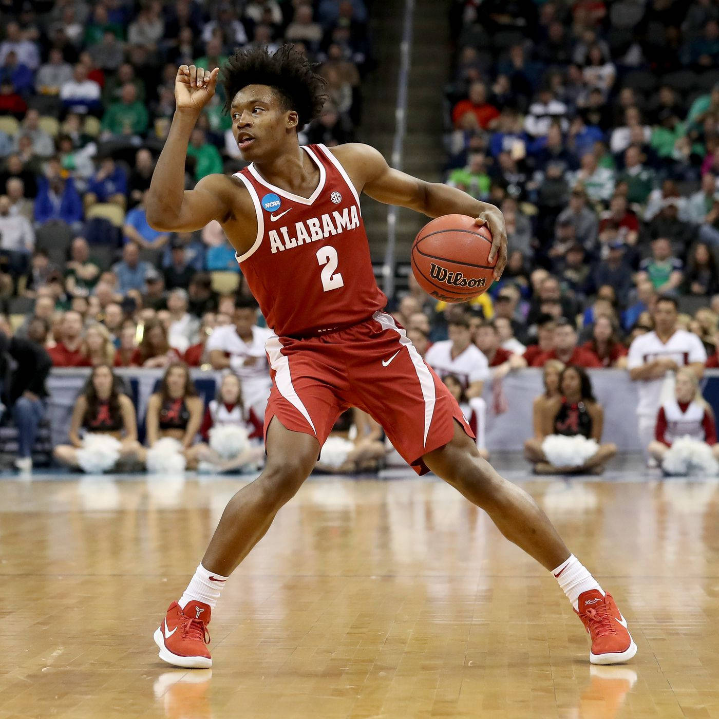 Basketball Star Collin Sexton In Red Team Jersey Wallpaper