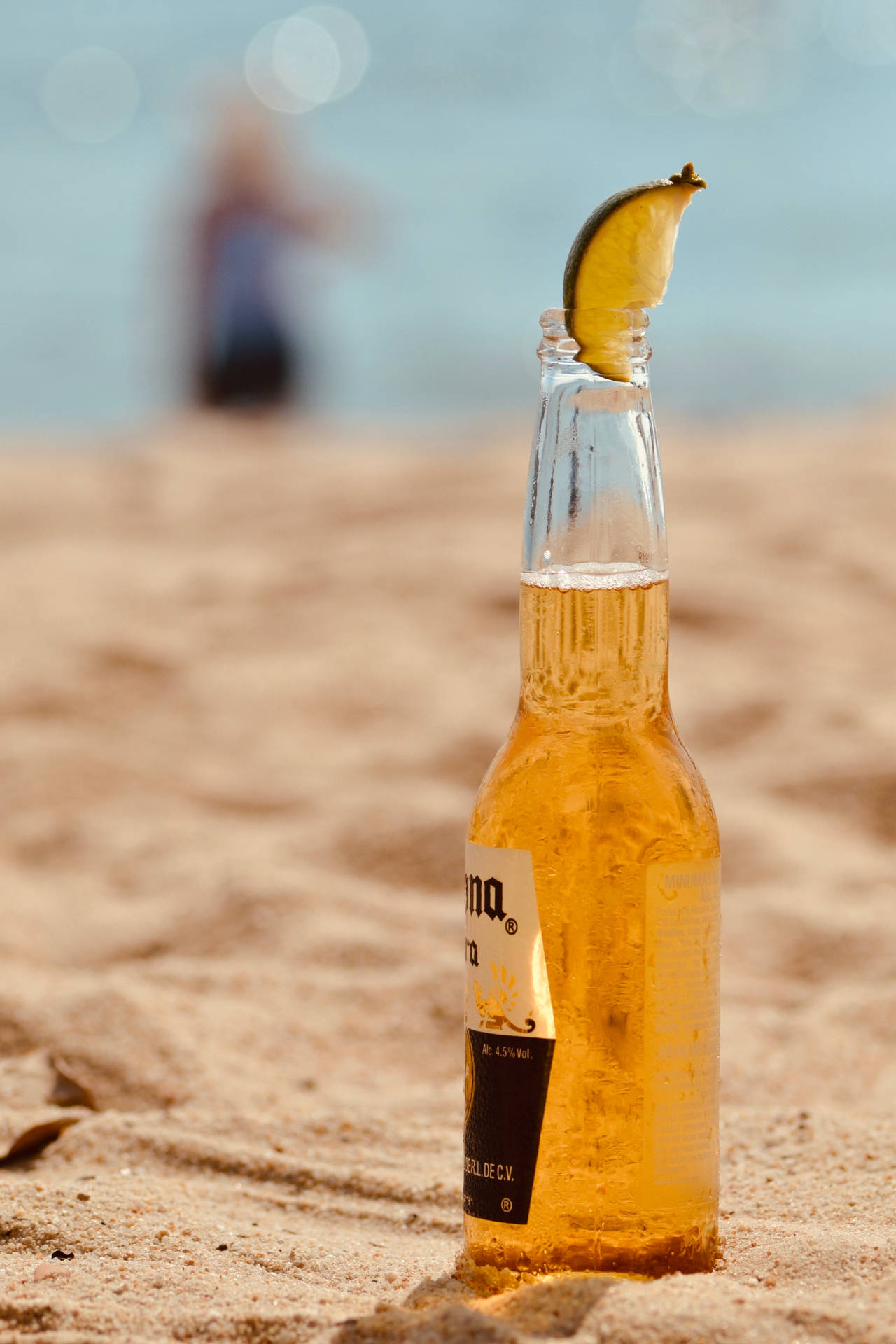 Beer Bottle Corona With Lime Wedge Wallpaper