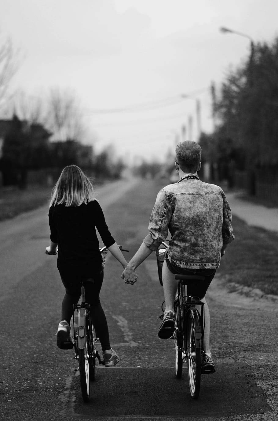 Bike Lovers Holding Hands Wallpaper