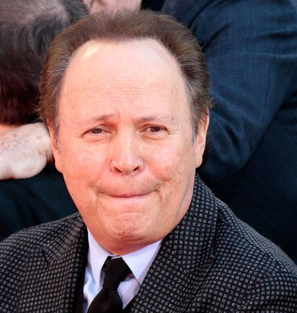 Billy Crystal Capturing Amusement With An Awkward Expression Wallpaper