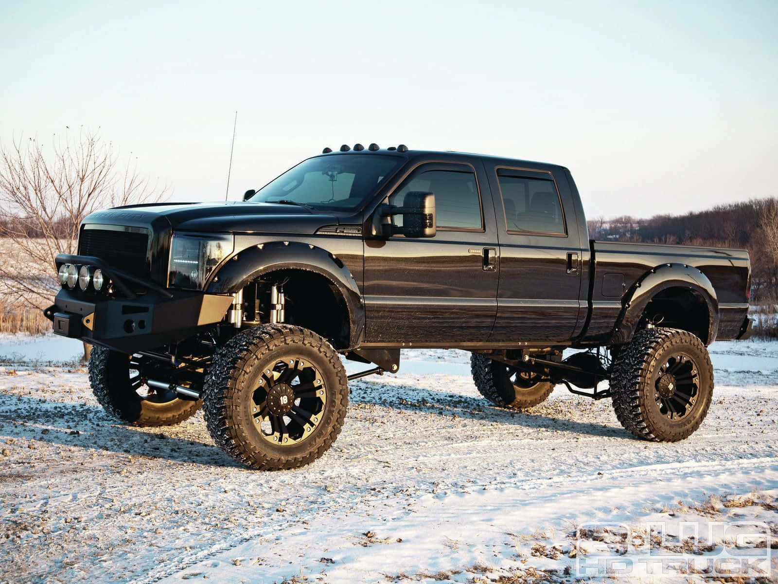 Black Lifted Truck On Snow Wallpaper